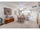 Cozy dining area with a round table, chairs, and adjacent kitchen access for easy serving at 12300 Vonn Rd # 3204, Largo, FL 33774