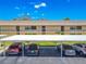 Exterior of a condo building, showing a carport and lush greenery under a beautiful blue sky at 12300 Vonn Rd # 3204, Largo, FL 33774