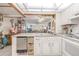 Well-lit kitchen with stainless steel appliances and an open view of the living area, ideal for socializing at 12300 Vonn Rd # 3204, Largo, FL 33774