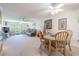 Open-concept living room boasts comfortable seating, neutral colors, and plenty of natural light at 12300 Vonn Rd # 3204, Largo, FL 33774
