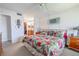 Bright main bedroom with floral bedding, ensuite bathroom access, and ample natural light at 12300 Vonn Rd # 3204, Largo, FL 33774