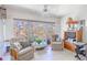 Charming sunroom filled with sunlight, comfortable seating, and views of the outdoors at 12300 Vonn Rd # 3204, Largo, FL 33774