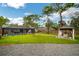 Spacious backyard with a pool, gazebo, and lush lawn at 12476 Jaybird Rd, Weeki Wachee, FL 34614