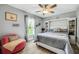 Bedroom with built-in shelving and a ceiling fan at 12476 Jaybird Rd, Weeki Wachee, FL 34614