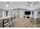 Open living space with kitchen island and fireplace at 12476 Jaybird Rd, Weeki Wachee, FL 34614