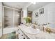 Clean bathroom with a shower/tub combo, vanity, and updated fixtures at 12476 Jaybird Rd, Weeki Wachee, FL 34614
