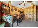 Game room with pinball machine, arcade game, and wood walls at 12476 Jaybird Rd, Weeki Wachee, FL 34614