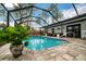Relaxing screened-in pool with ample surrounding space at 12476 Jaybird Rd, Weeki Wachee, FL 34614