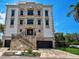 Stunning 3-story home with stone accents and a grand entrance at 3087, 3075 Cherry Ln, Clearwater, FL 33759