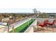 Cozy rooftop deck seating area with scenic neighborhood views at 3087, 3075 Cherry Ln, Clearwater, FL 33759