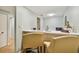Small kitchenette with white countertops, stainless steel appliances, and breakfast bar at 36750 Us Highway 19 N # 12-106, Palm Harbor, FL 34684