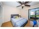 Bedroom with full-size bed and sliding door to patio at 180 Ingrid Pl, Oldsmar, FL 34677