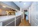 Modern kitchen with stainless steel appliances and a passthrough to the dining area at 180 Ingrid Pl, Oldsmar, FL 34677