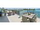 Spacious balcony with seating area and water views at 1848 Shore S Dr # 501, South Pasadena, FL 33707