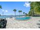 Community pool with patio furniture and beautiful waterfront views at 1848 Shore S Dr # 501, South Pasadena, FL 33707