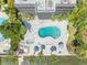 Aerial view of kidney-shaped pool, spa, and lounge area at 1848 Shore S Dr # 501, South Pasadena, FL 33707