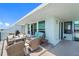 Relaxing balcony with outdoor seating and partial water view at 1848 Shore S Dr # 501, South Pasadena, FL 33707