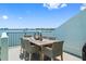 Enjoy water views from this furnished balcony dining area at 1848 Shore S Dr # 501, South Pasadena, FL 33707