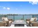 Relaxing balcony with patio furniture and stunning waterfront views at 1848 Shore S Dr # 501, South Pasadena, FL 33707