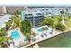 Aerial view of waterfront community with pools and lush landscaping at 1848 Shore S Dr # 501, South Pasadena, FL 33707