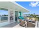 Large balcony with multiple seating areas and water views at 1848 Shore S Dr # 501, South Pasadena, FL 33707