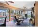 Gathering room with pool view, comfortable seating, and large sliding glass doors at 429 3Rd N Ave, Tierra Verde, FL 33715