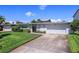 Mid-century modern home with driveway at 429 3Rd N Ave, Tierra Verde, FL 33715