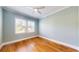 Bright bedroom with hardwood floors and ceiling fan at 210 Catalan Ne Blvd, St Petersburg, FL 33704