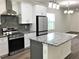 Modern kitchen with granite countertops and stainless steel appliances at Tbd 18Th Sw Ave, Largo, FL 33774