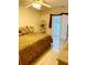 Cozy bedroom features bright natural light, ceiling fan and tile flooring at 1655 S Highland Ave # J194, Clearwater, FL 33756