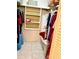 Organized walk-in closet featuring built in shelves and ample storage space at 1655 S Highland Ave # J194, Clearwater, FL 33756