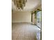 Spacious living room with tile floors and sliding glass doors to the outside at 1655 S Highland Ave # J194, Clearwater, FL 33756
