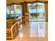 Cozy living room featuring tile floors, a patio, and a view of the water at 1655 S Highland Ave # J194, Clearwater, FL 33756