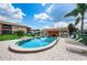 Community pool with surrounding patio and lounge chairs at 2250 Druid E Rd # 605, Clearwater, FL 33764