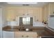 Updated kitchen with granite countertops and a pass-through window at 2250 Druid E Rd # 605, Clearwater, FL 33764