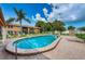 Community pool with lounge chairs and patio area at 2250 Druid E Rd # 605, Clearwater, FL 33764