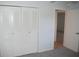 Bright bedroom with double doors leading to a spacious closet and additional room at 2250 Druid E Rd # 605, Clearwater, FL 33764