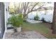 Landscaped backyard with brick patio and white bench at 9720 Indian Key Trl # 117, Seminole, FL 33776