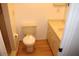 Clean bathroom with beige tile and wood-look flooring at 9720 Indian Key Trl # 117, Seminole, FL 33776