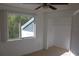 Bedroom with window, ceiling fan and closet at 9720 Indian Key Trl # 117, Seminole, FL 33776