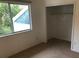Bedroom with window and closet at 9720 Indian Key Trl # 117, Seminole, FL 33776