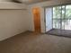 Bright bedroom featuring a private balcony and spacious closet at 9720 Indian Key Trl # 117, Seminole, FL 33776
