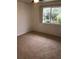 Bedroom with window, ceiling fan and carpet at 9720 Indian Key Trl # 117, Seminole, FL 33776