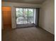 Bedroom with balcony access and walk-in closet at 9720 Indian Key Trl # 117, Seminole, FL 33776