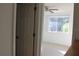 Bedroom with window, ceiling fan and door at 9720 Indian Key Trl # 117, Seminole, FL 33776