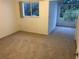 Spacious bedroom with carpet flooring and sunlit alcove at 9720 Indian Key Trl # 117, Seminole, FL 33776