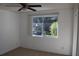 Bright bedroom with window, ceiling fan and carpet at 9720 Indian Key Trl # 117, Seminole, FL 33776