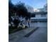 Two-story white townhouse with a two-car garage and landscaping at 9720 Indian Key Trl # 117, Seminole, FL 33776