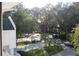 Community view showcasing lush landscaping and mature trees at 9720 Indian Key Trl # 117, Seminole, FL 33776