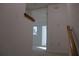 Upper level hallway with access to a room and stairs at 9720 Indian Key Trl # 117, Seminole, FL 33776